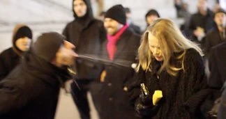 2013: A Jewish communist (left) spits on a ball attendee.